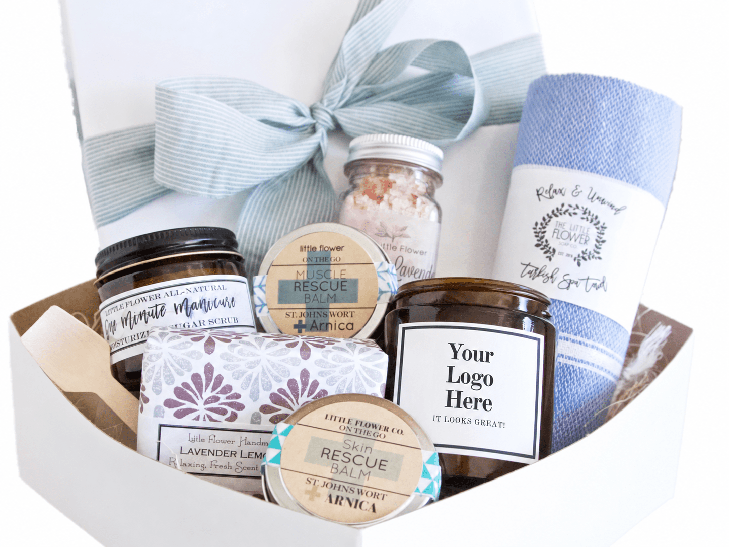Corporate spa gift box with a candle showing a custom logo label